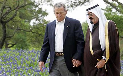 President George W. Bush holds hands with Saudi Crown Prince Abdullah